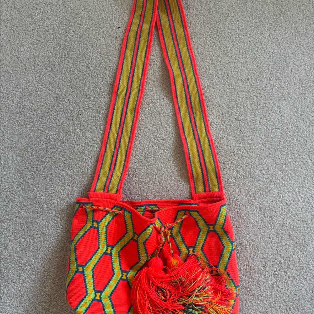 Vibrant red, orange and yellow woven Wayuu Colombian handmade Mochila bag.